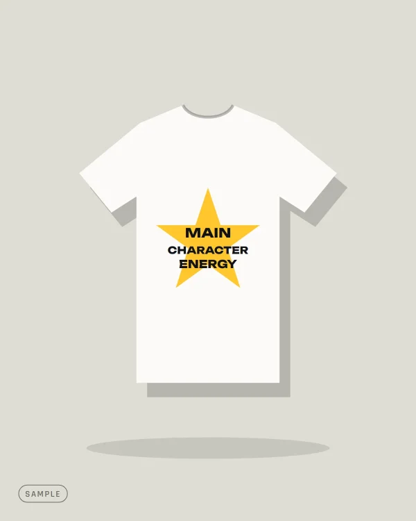 White oversized T-shirt with a yellow star reading "MAIN CHARACTER ENERGY" (sample artwork)