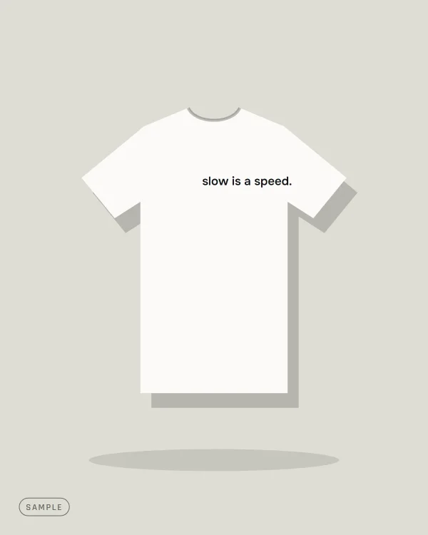 White T-shirt with the small chest slogan "slow is a speed." (sample artwork)